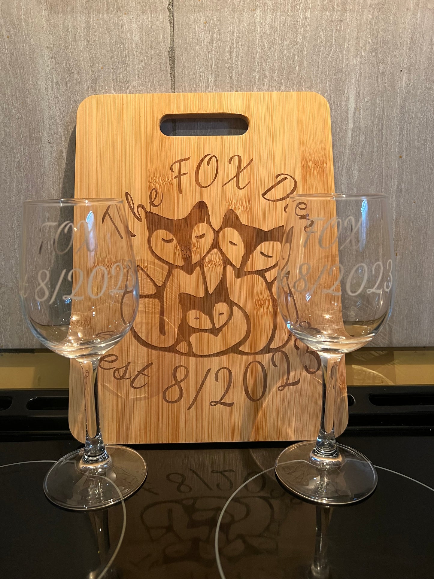 Engraved cutting board and 2 wine glasses